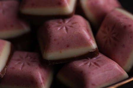 White Chocolate with Mixed Berry bar. Pink white brown chocolate layers. Dessert sweets chocolateの写真素材