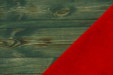 Red matte background of suede fabric, closeup. Velvet texture of seamless leather. Felt material macro. Red suede texture. Fabric, leather, material for designers.の写真素材