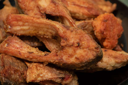 Fish fried in flour in the oven. fried fish in chunks, homemade food, healthy food. Fried fish in...