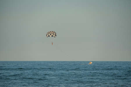 A paraglider over the sea.の写真素材