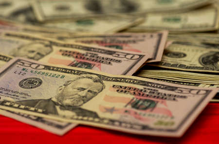 dollars background. Dollars background. Background of different us dollar banknotes. Finance concept. Dollars different bills.の写真素材