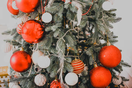 New Year's interior. Christmas tree. Christmas decorations. Luxury. New Year's toys Christmas tree gifts. Photo with tinted. New Yearの写真素材