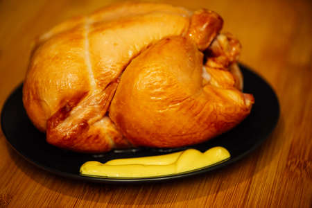 Food concept organic. smoked chicken on a black plateの写真素材