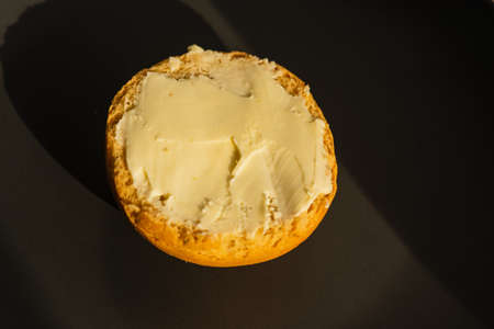 Buttered bread roll. Lovely and crusty, ready to eat. Bread with butterの写真素材