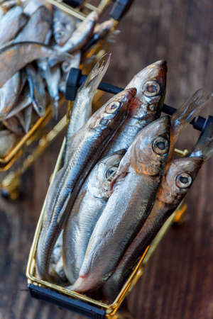 Fresh sprat. Sprat in the grocery cart. A fishの写真素材