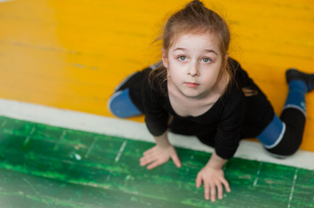 little girl doing gymnastics. little gymnast girl in gym. Girl gymnast in the gym. Sport health.の写真素材