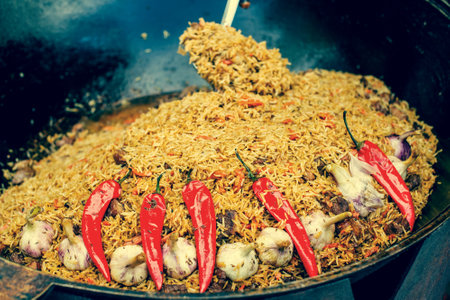Fragrant delicious pilaf with garlic and pepper large. Street festive freshly prepared food.の写真素材