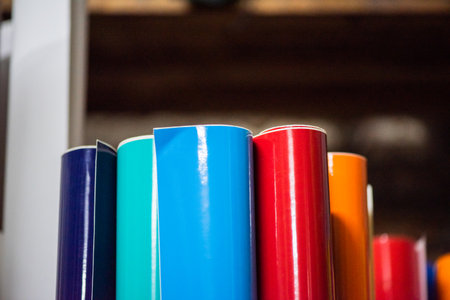 colored vinyl car wrapping or plotter cutting sticker foil film rolls. Film in rolls for advertisingの写真素材