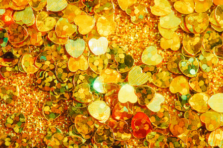 Valentines day decorative hearts on glitter background. Hearts on a gold background.