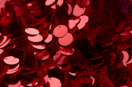 Sparkling sequins. Red sequin fabric for background. rectangular red shiny fabric, Christmas