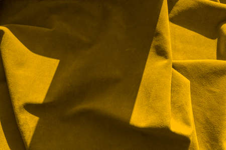 Velvet texture of seamless leather. Felt material macro. Yellow suedeの写真素材