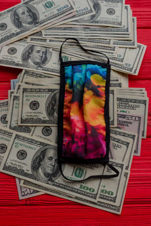 Dollars closeup photo of American Dollar. Macro shot. virus protection mask.の写真素材