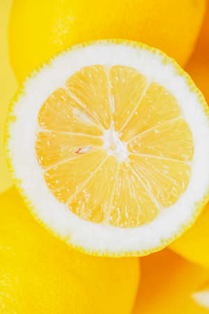 High Angle View Of Lemon Arranged Over Yellow Background. citrus