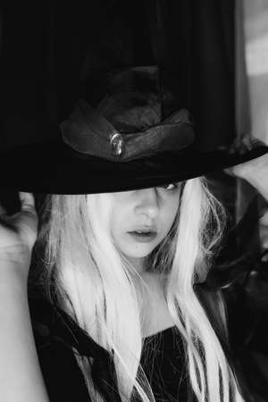 Beautiful girl looking at the camera. Very tender. Portrait of a girl 10 years old indoors.の写真素材