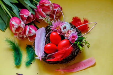 Bouquet of tulips and as a background for post card. holiday. Painted red eggs. Happy Easter