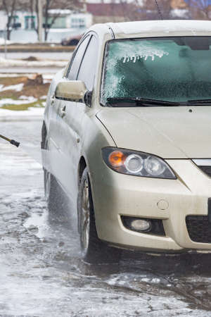 car wash with water and foam cleaning. auto, service vehicle industry wash auto, serviceの写真素材