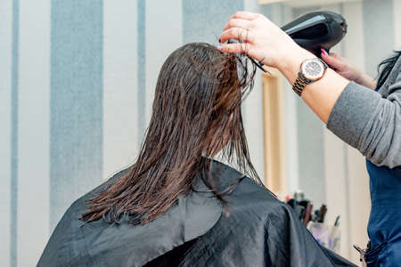 Happy Girl Getting her Hair Cut. A series of photos of a girl getting her hair cut. haircut, girl,の写真素材