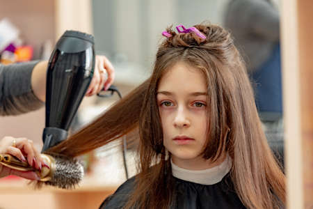Happy Girl Getting her Hair Cut. A series of photos of a girl getting her hair cut. haircut, girl,