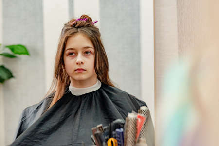 Happy Girl Getting her Hair Cut. A series of photos of a girl getting her hair cut. haircut, girl,の写真素材