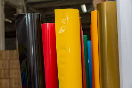 colored vinyl car wrapping or plotter cutting sticker film rolls. Film in rolls for advertisingの写真素材