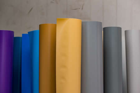 colored vinyl car wrapping or plotter cutting sticker film rolls. Film in rolls for advertisingの写真素材