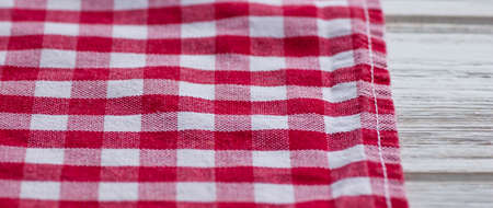 Red and white kitchen cotton fabric in a cage. fabric cotton texture checkered