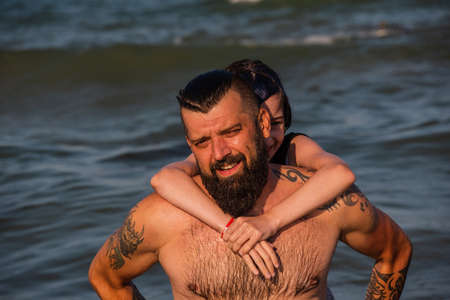Dad and daughter swimming in the sea. family on beach on vacation. family vacation summerの写真素材