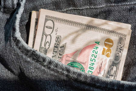 dollar banknotes. money in your pocket. paper money, currency, cash. close-up. finance, payments