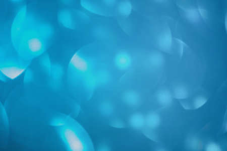 Glitter background, new year. Defocus light blue christmas color.