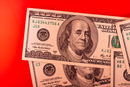 Financial concept. Paper money American dollars on a red background.の写真素材
