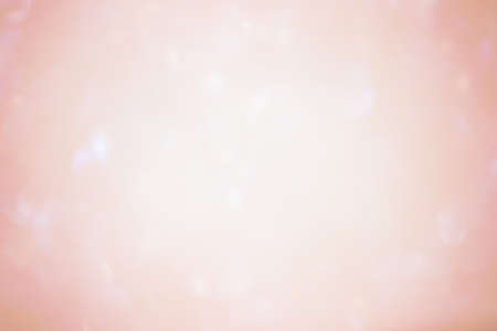 Abstract background blur focus. Defocus light orange sparkles glitter.の写真素材