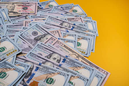 American dollars on a yellow background. The growth of the dollar. finance and banks.