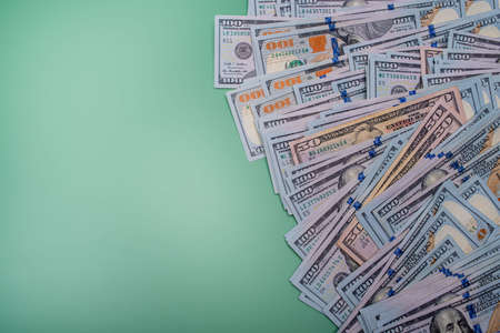 American dollars on a green background. The growth of the dollar. finance and banks.の写真素材