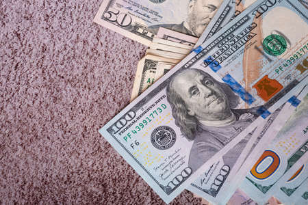Many American dollars on a gray cement background. business, wealth.の写真素材