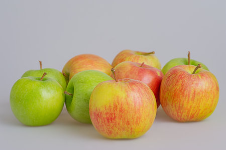 Fruits red and green apples on a gray backgroundの写真素材