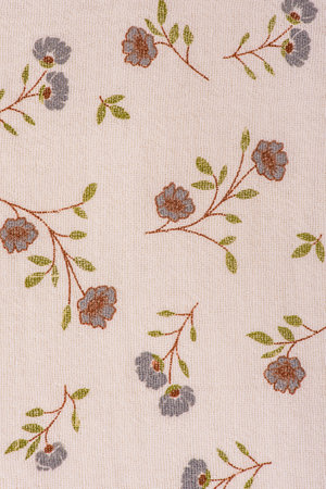 Texture of beige flower fabric. Cotton as a background.の写真素材