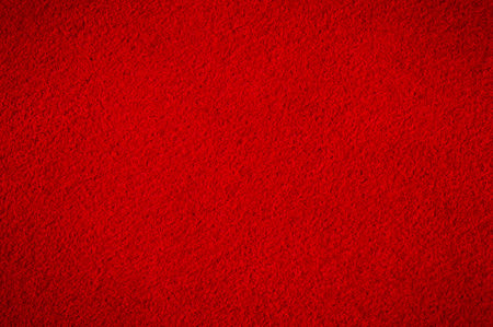 Red suede with darkening along the edge. Suede macro as a backgroundの写真素材