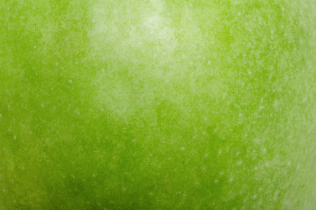 Green apple texture as a macro photo backgroundの写真素材