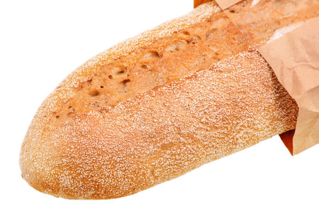 Buckwheat baguette isolated on a white background. Bread in a paper bagの写真素材