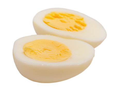 Boiled egg cut into two parts isolated on white backgroundの写真素材