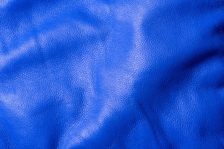 Blue genuine leather as a background macro photo. Blue backgroundの写真素材