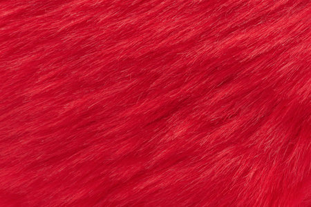 Horizontal photo of red faux fur macro photo as background