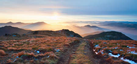 Beautiful landscape from Mount PipIvan in the morning light. Hiking. Dawn sunrise is beautiful in the mountains. Location place Carpathian mountains, Ukraine, Europe. Vibrant photo wallpaperの写真素材