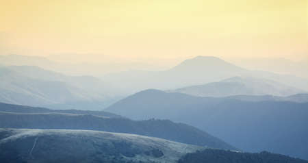 Beautiful sky and layers of the mountain after sunset.の写真素材