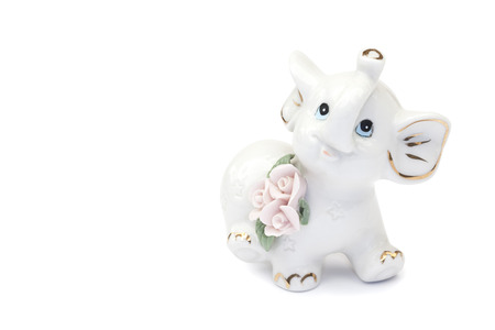 ceramic elephant figurine isolated over whiteの写真素材