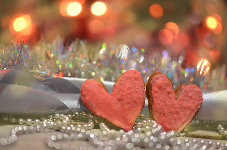 Heart haped cookies on a festive backgroundの写真素材