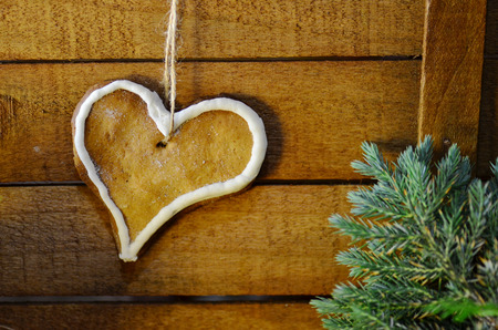 Heart shaped biscuits  on wooden background. Vintage love card with empty space for your text.の写真素材