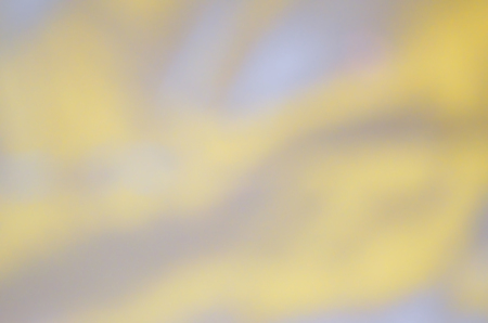 Blurred background sunset with bokeh sun light. Yellow bokeh background. Abstract blur golden bokeh lightingの写真素材