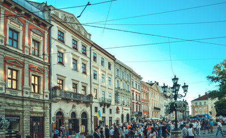 LVIV, UKRAINE - July 16, 2017: Lviv city landscape. Lviv old town with people. Colorful historical...