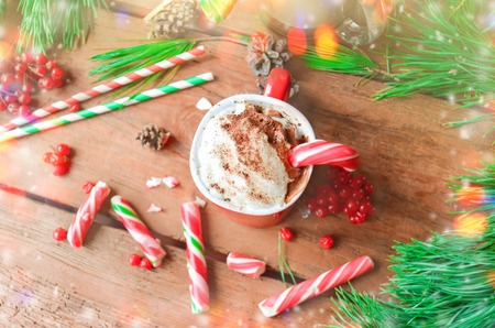Cup of tasty cocoa on blurred background.  Hot chocolate with peppermint candies. Christmas holiday background.の写真素材